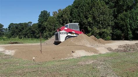 how to build a house pad with skid steer|kubota pad builder.